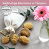 Menstruationsschwamm mit Kordel im Leinenbeutel mit rosa Blume